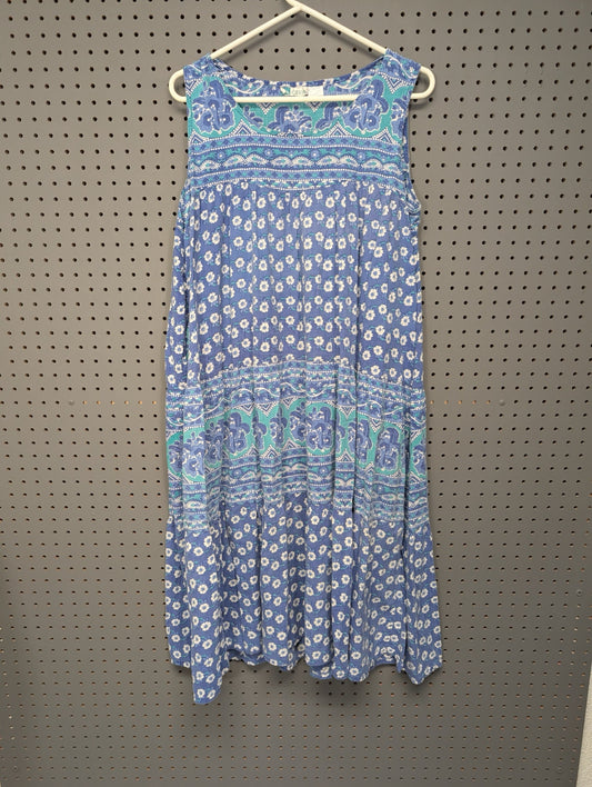 Front view of La Cera blue floral tiered dress