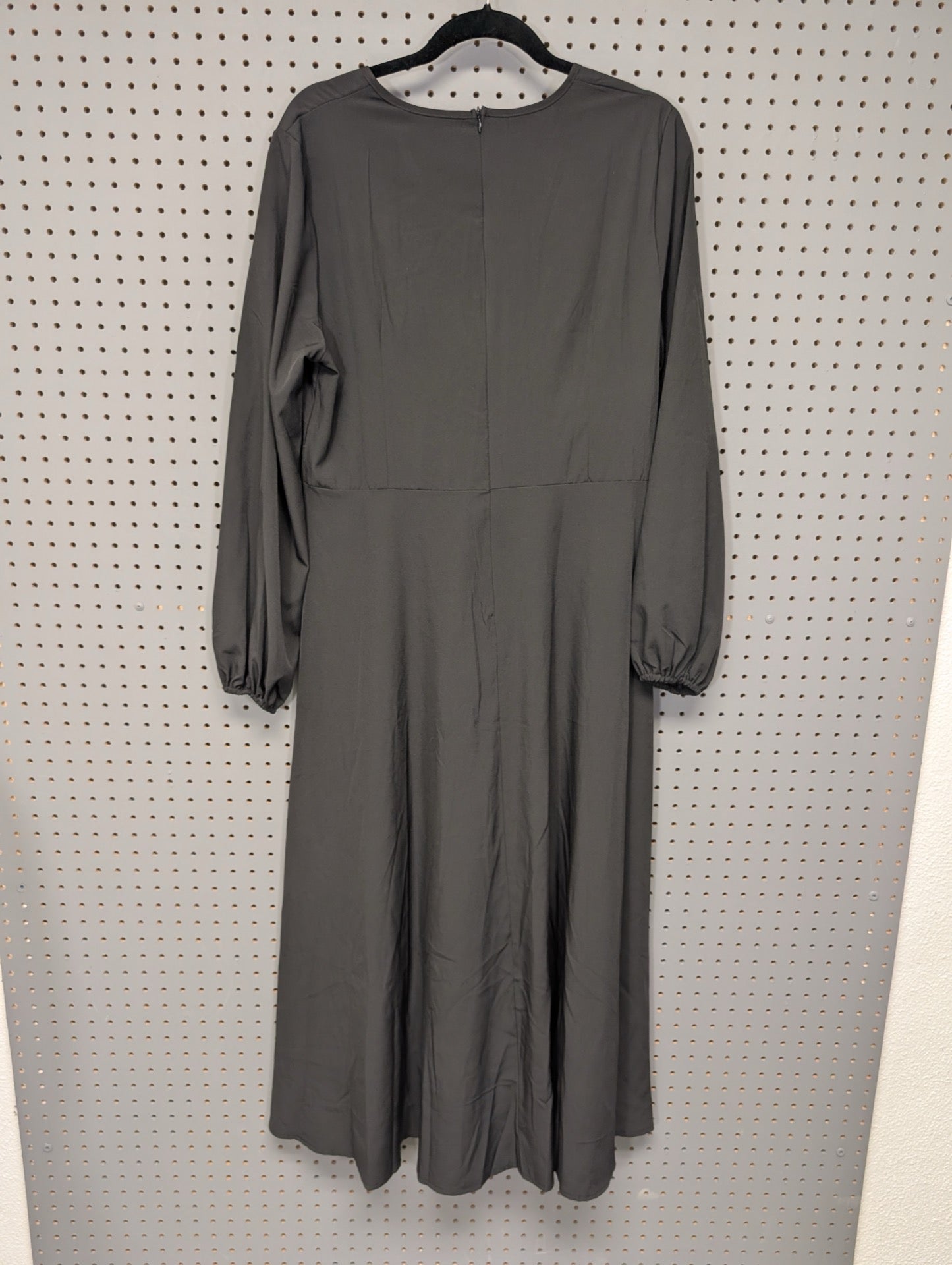 Back view of black long sleeve dress showing zipper