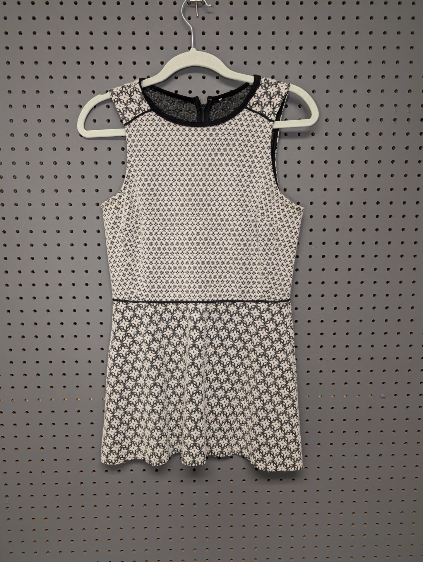 Front view of unbranded geometric peplum dress