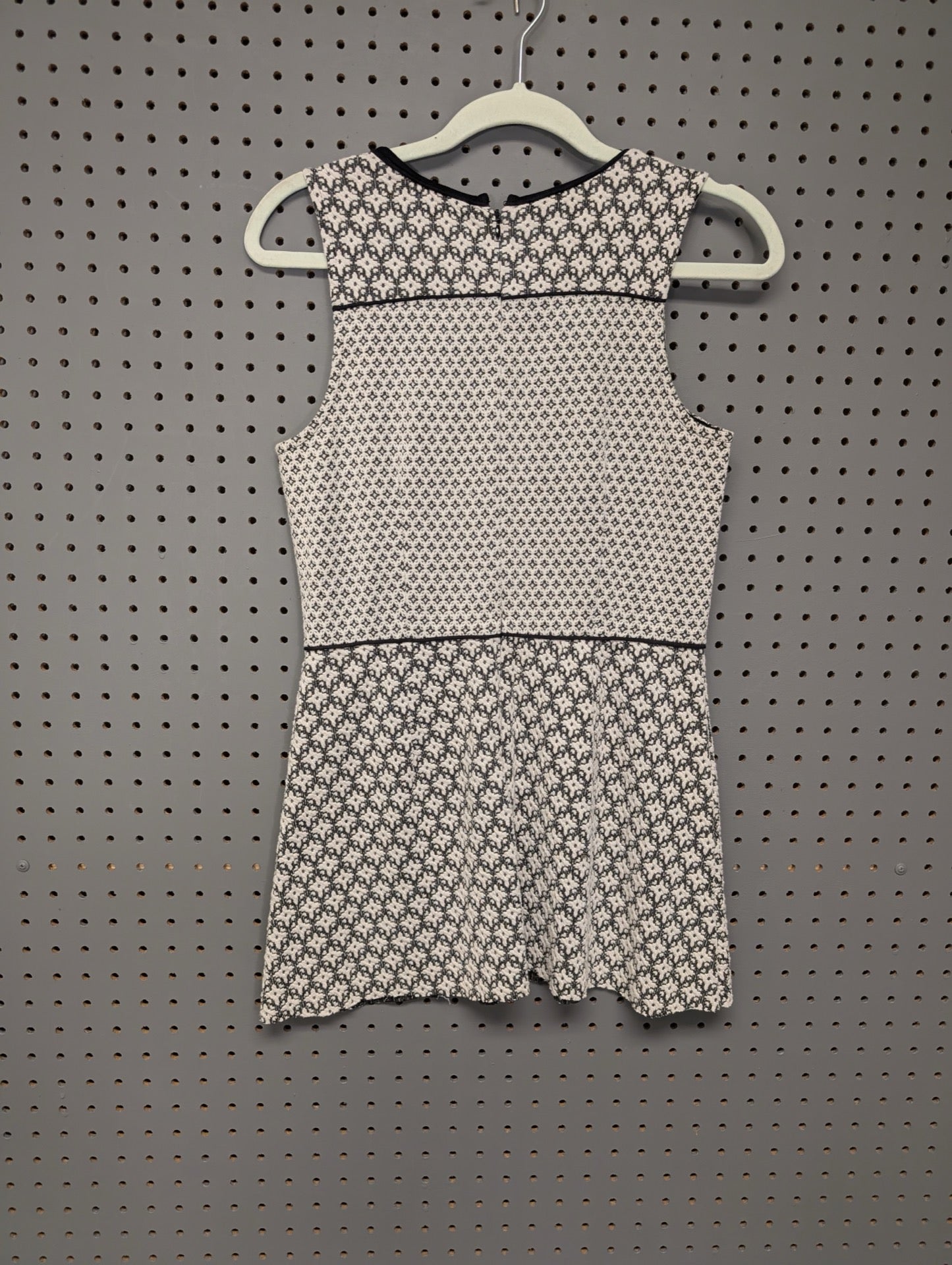 Back view of unbranded geometric peplum dress