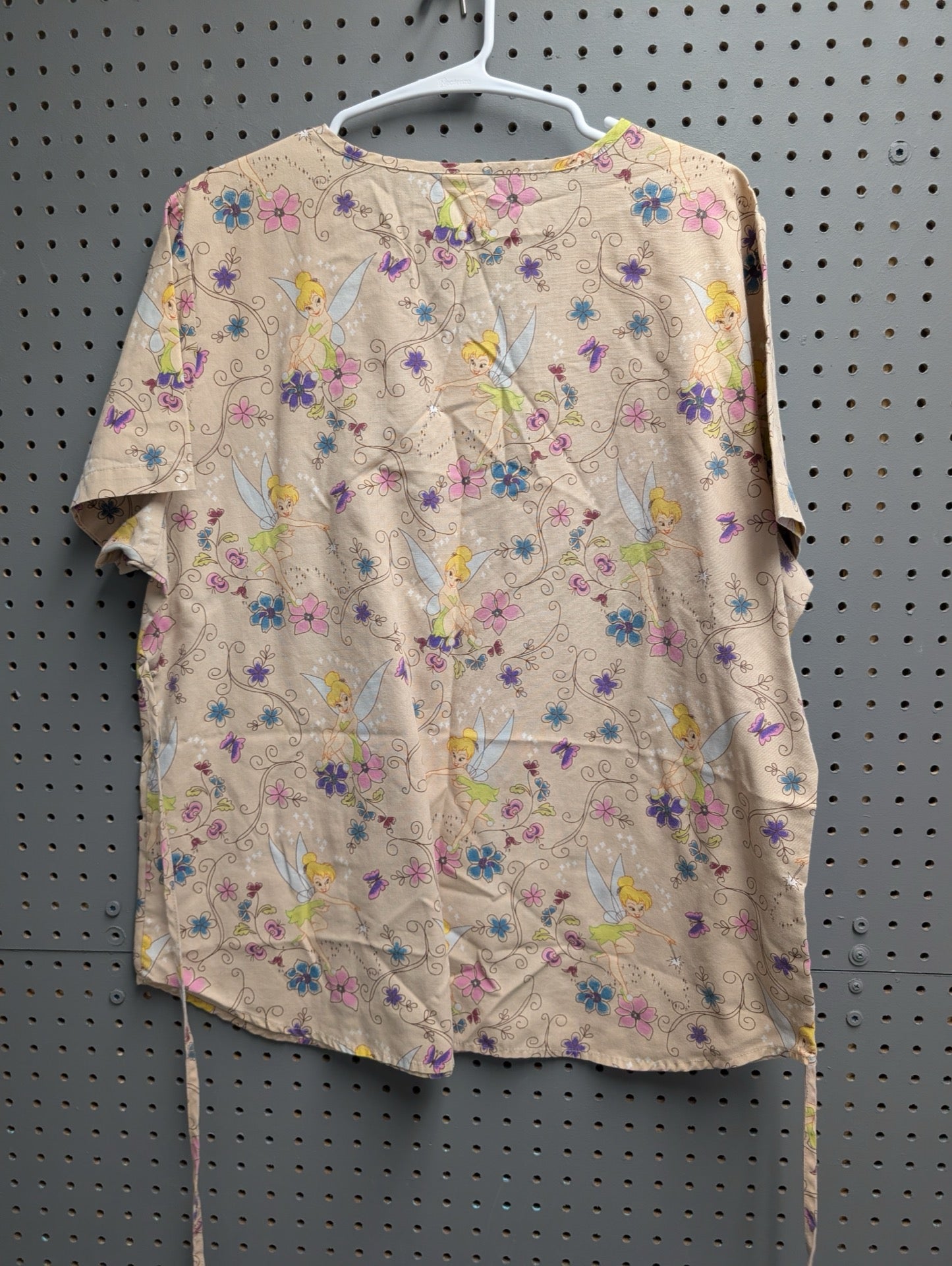 Back view of Tinkerbell floral scrub top showing ties