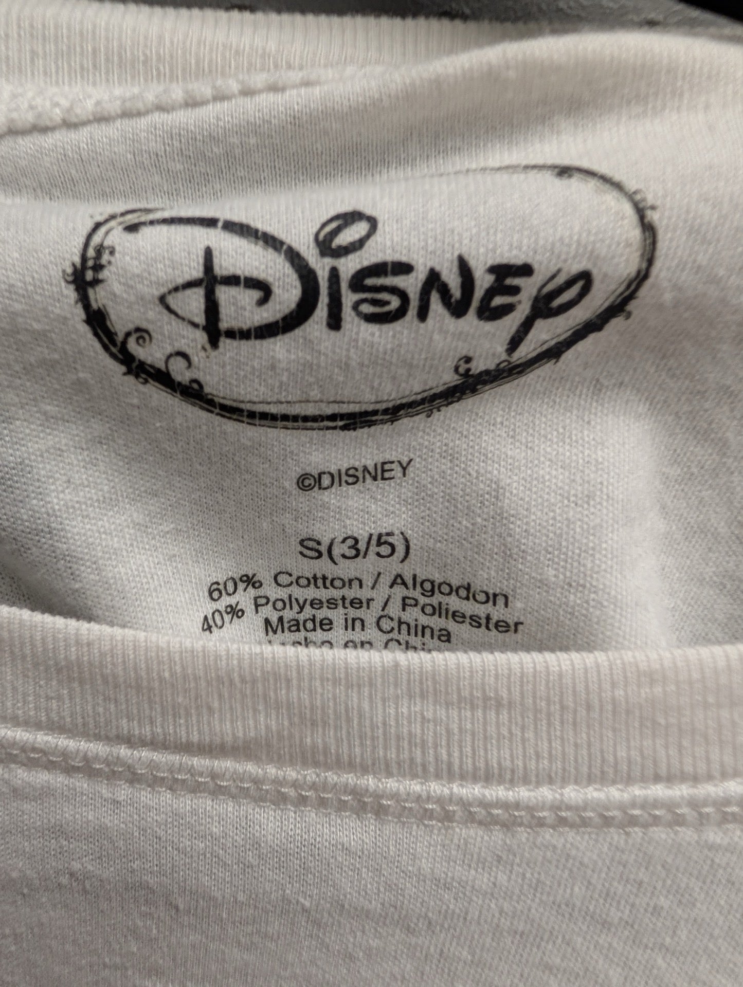 Close up of printed Disney size Small tag