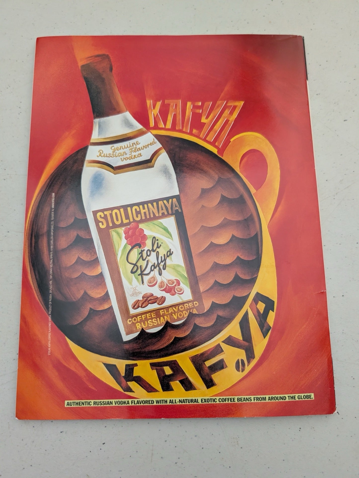 Back cover featuring a Stoli Kafya vodka advertisement