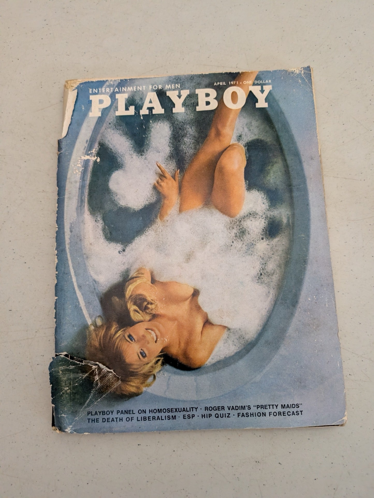 Front cover of vintage April 1971 Playboy Magazine showing wear
