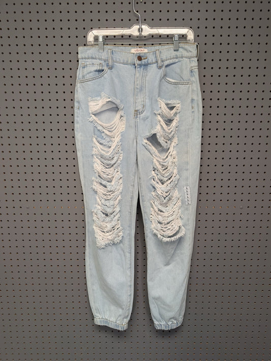 Front of Vibrant MIU heavily distressed denim joggers