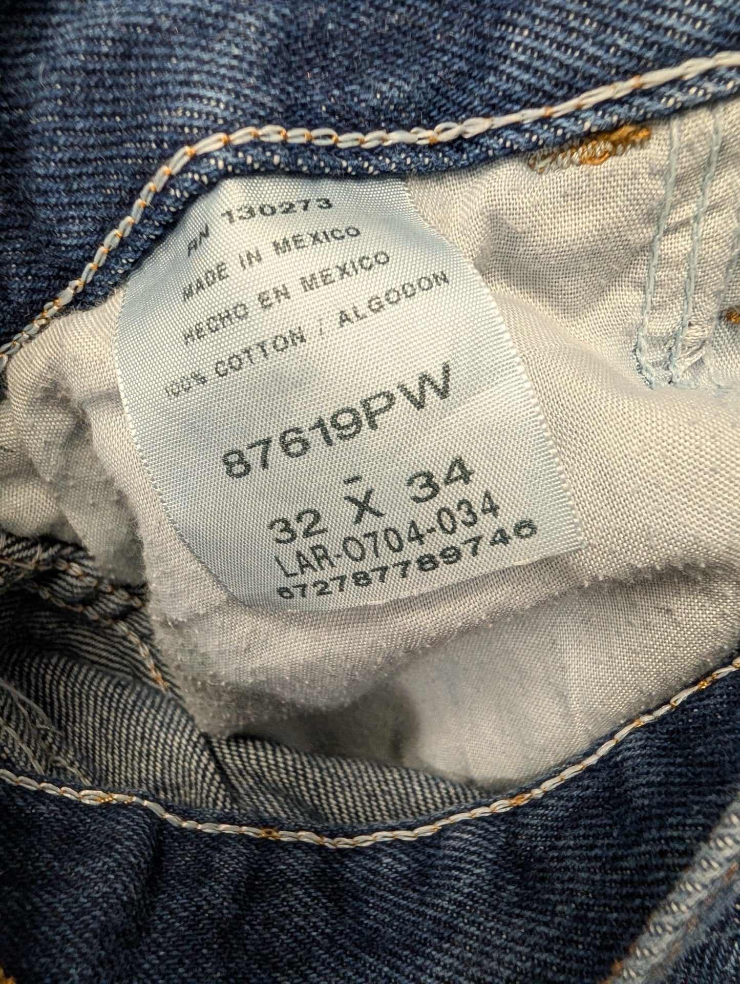 Rustler tag showing size 32x34