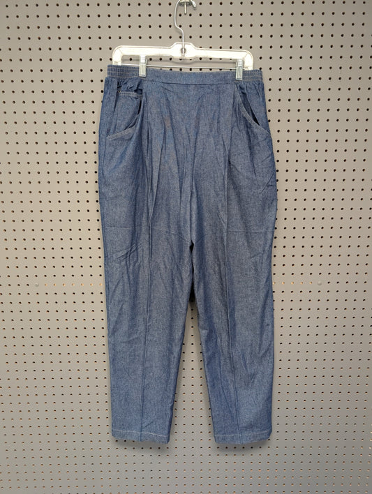 Front view of vintage Tumbleweeds pleated jeans