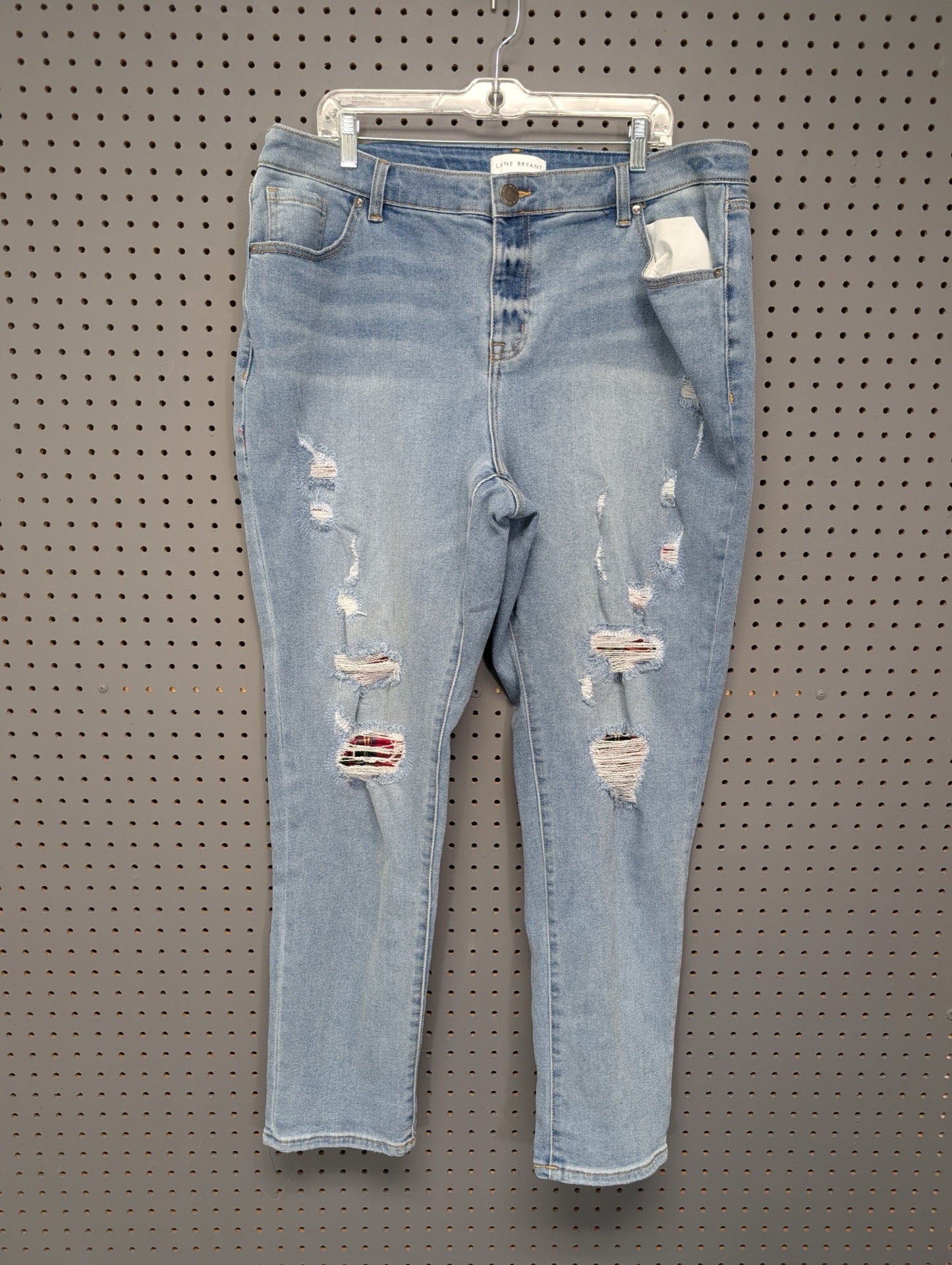 Front of Lane Bryant size 16 distressed jeans with plaid patches