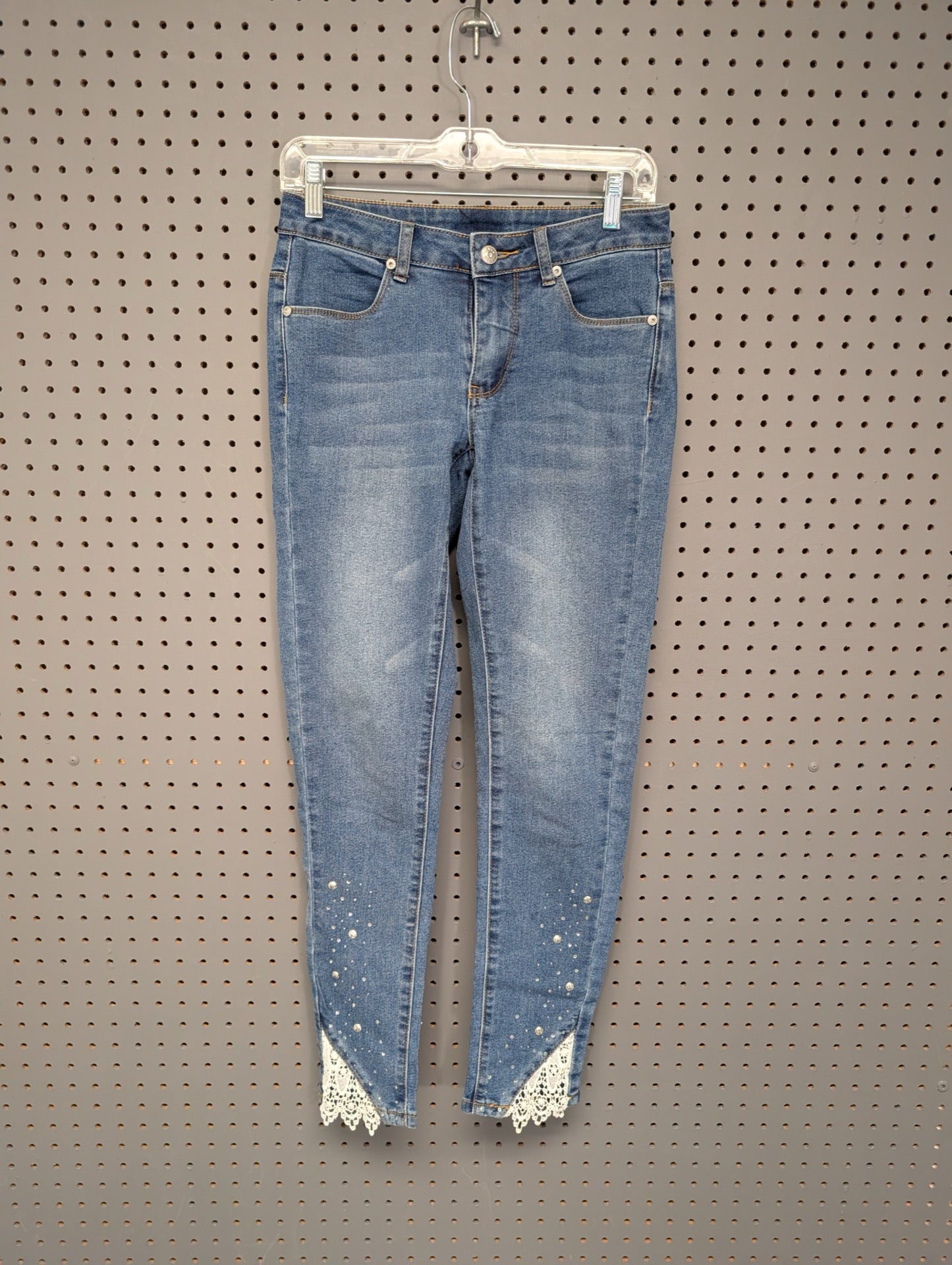 Front view of Venus skinny jeans with rhinestones and lace