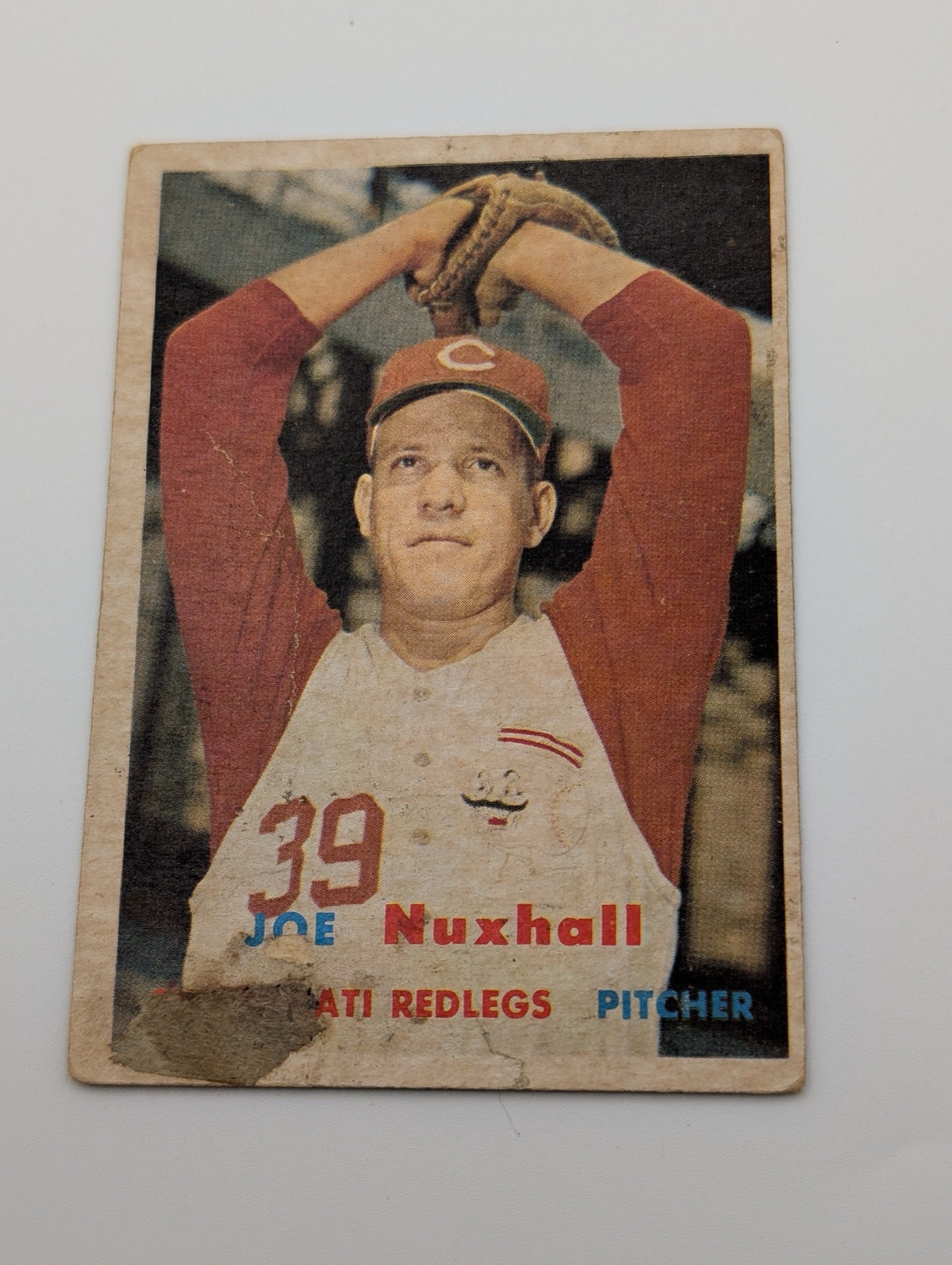 Front of 1957 Topps Joe Nuxhall #103 baseball card showing damage