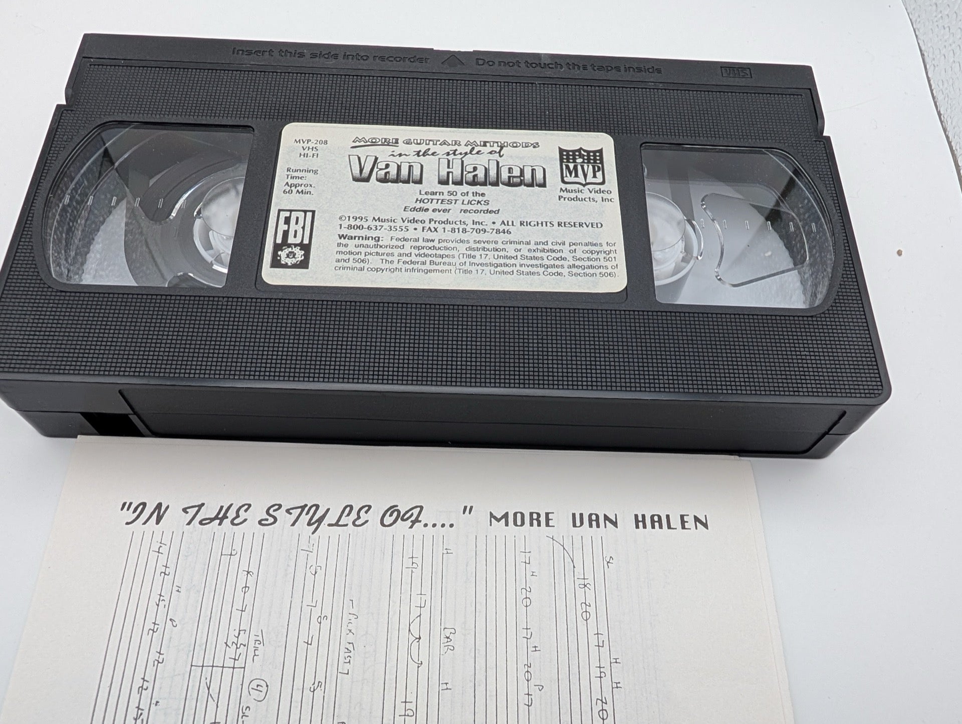 The VHS cassette tape and tablature insert