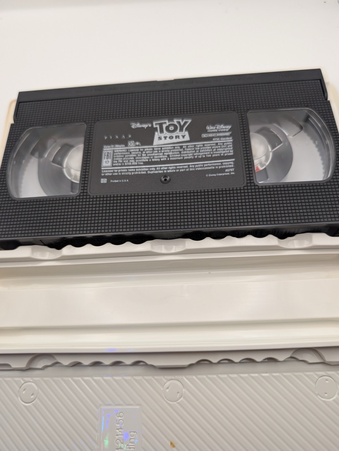 Inside of Toy Story VHS clamshell showing tape