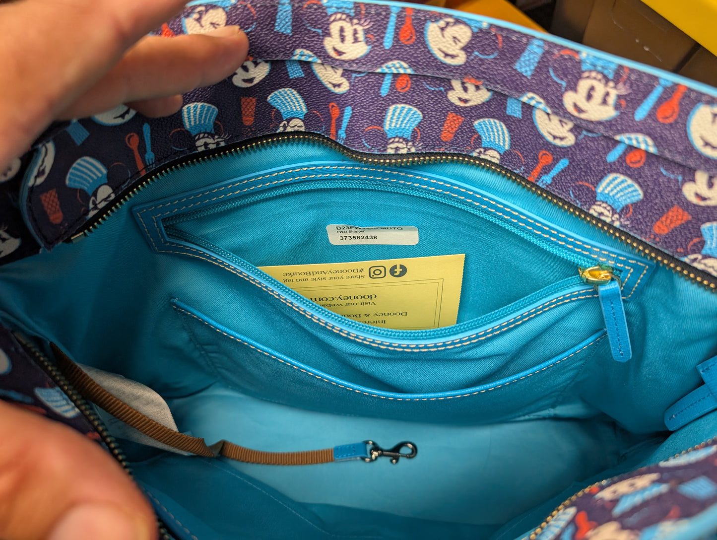 Epcot International Food & Wine Festival 2023 Tote Bag from Dooney & Bourke - 2023 Handbag (Coated Cotton, Leather Tote Bag, Disney Characters, Food, Epcot, Navy Blue, Bright Blue)