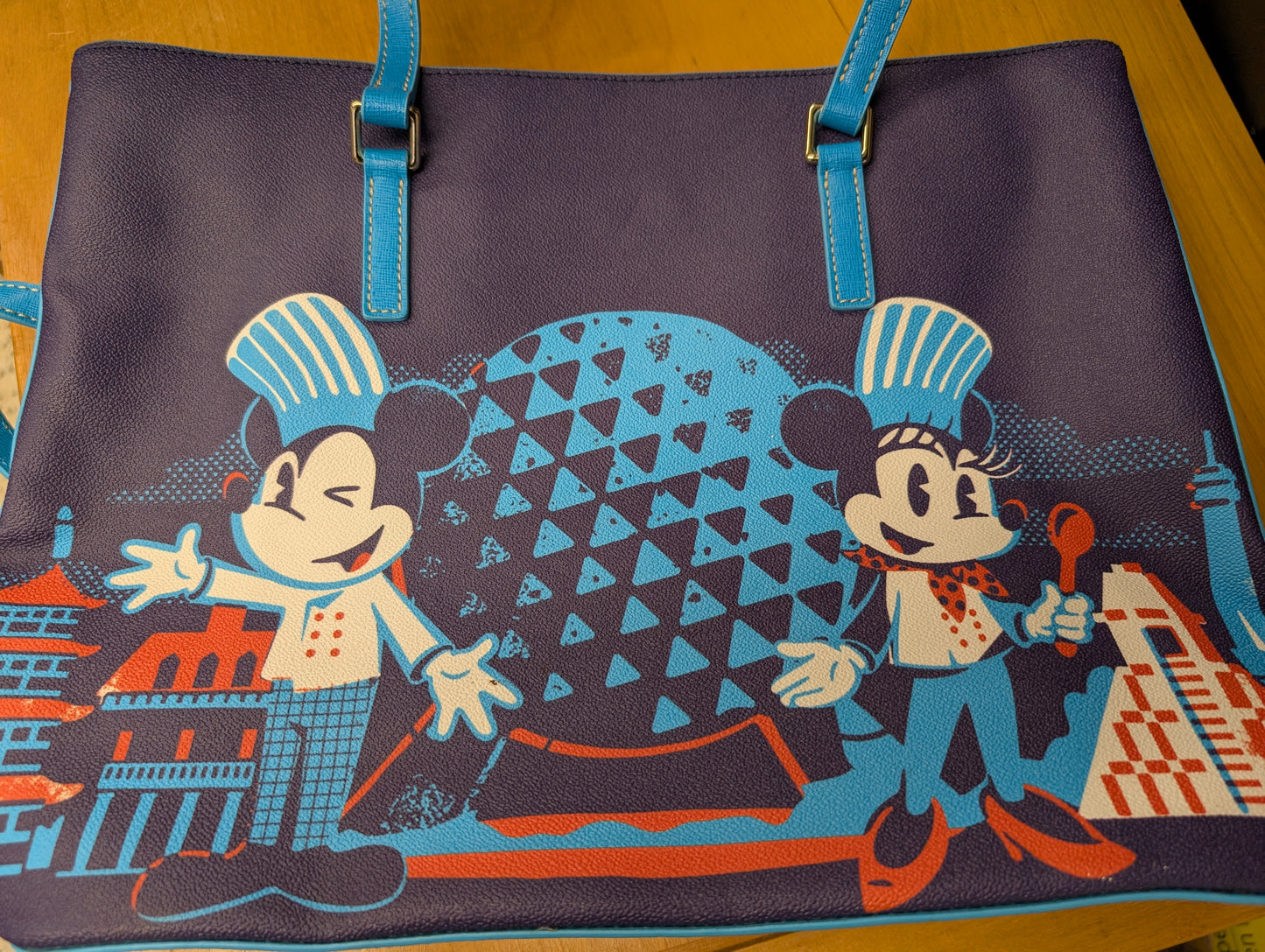 Epcot International Food & Wine Festival 2023 Tote Bag from Dooney & Bourke - 2023 Handbag (Coated Cotton, Leather Tote Bag, Disney Characters, Food, Epcot, Navy Blue, Bright Blue)